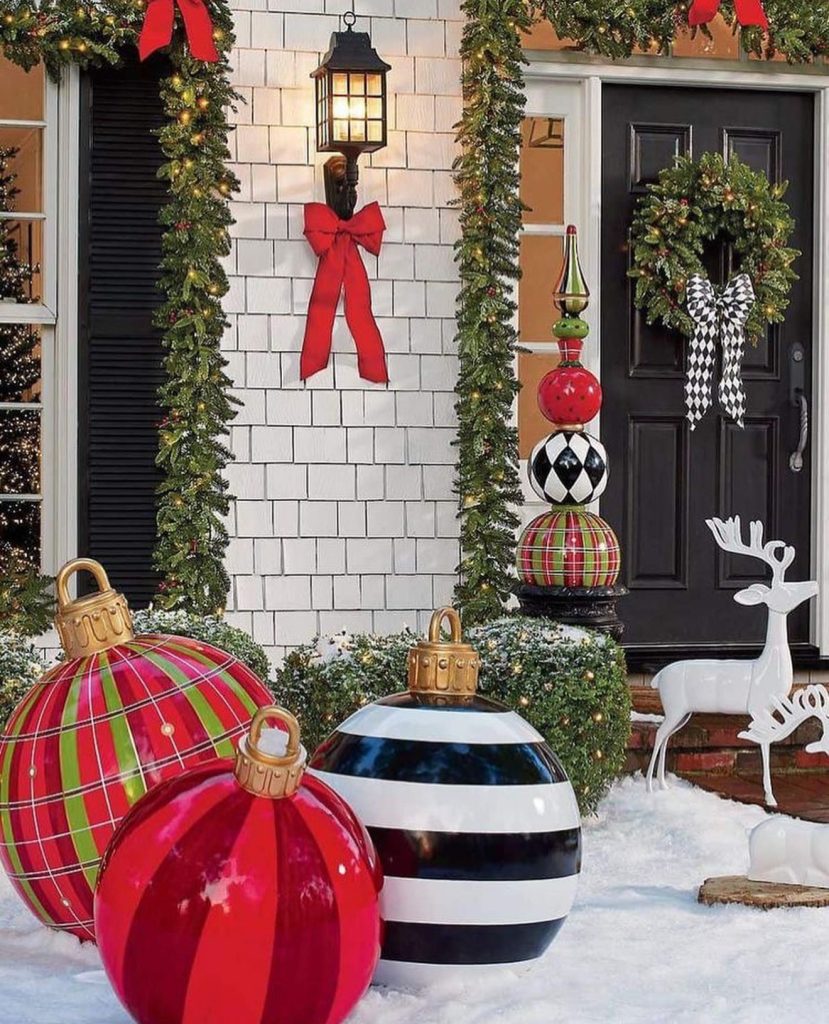 Large Christmas decorations on snowy lawn