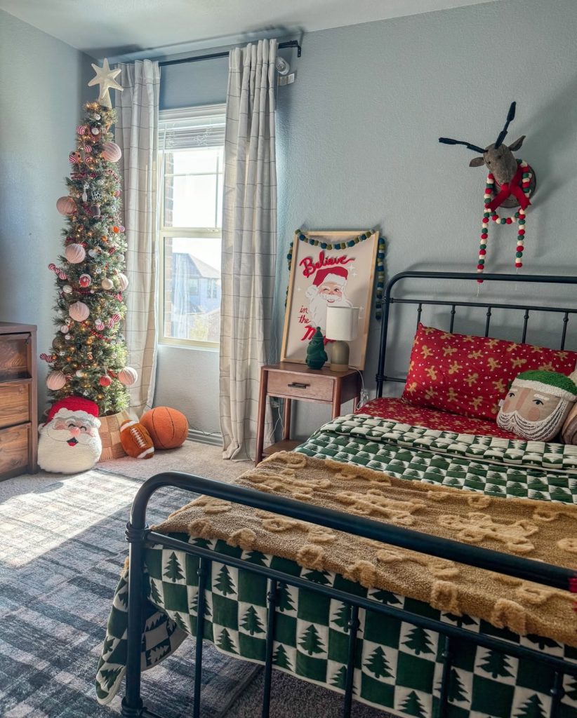 Kids' Christmas room with green bedding and candy cane tree