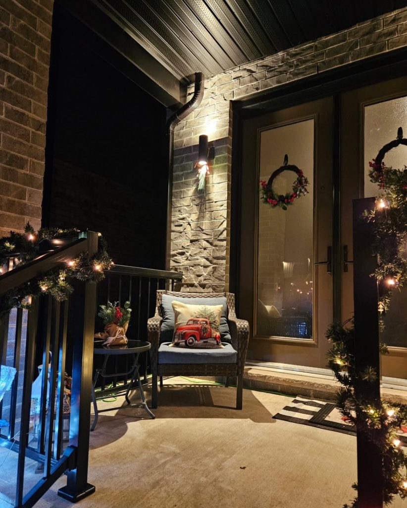 Christmas porch with warm nighttime lighting
