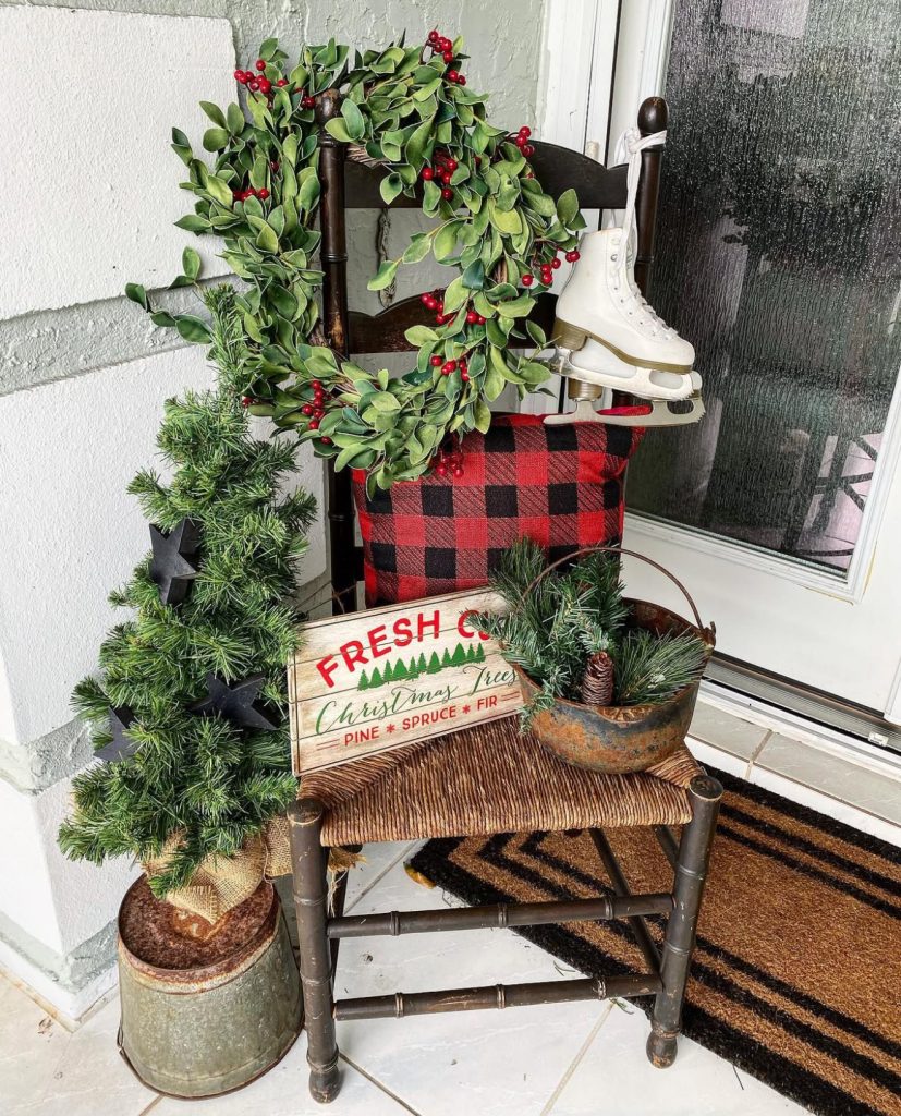 Vintage Christmas porch with ice skates and plaid
