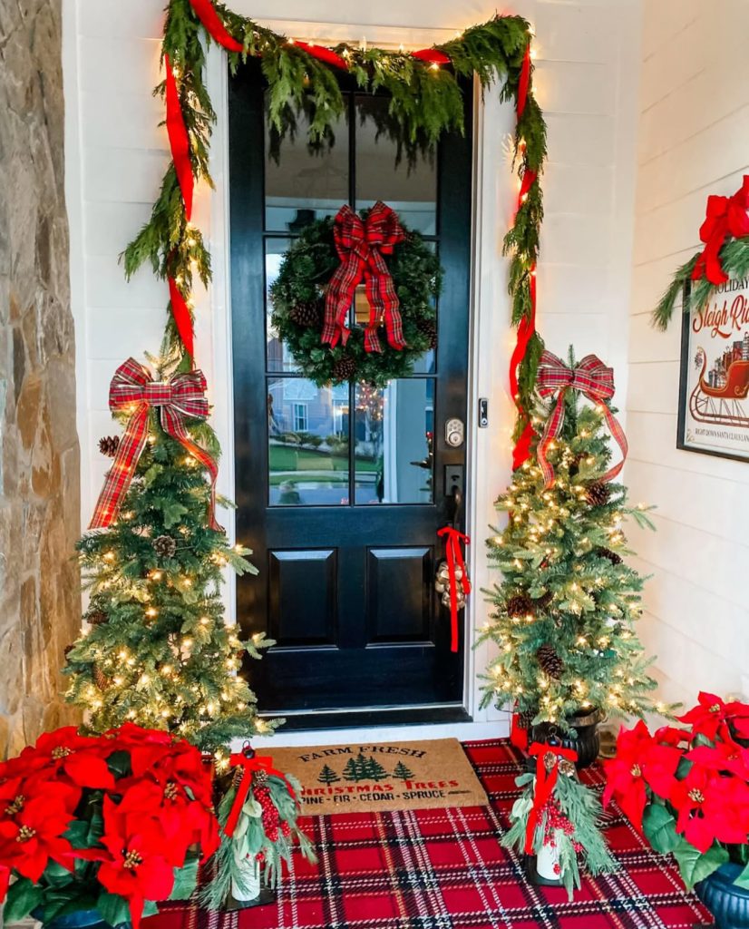 Plaid and greenery Christmas porch