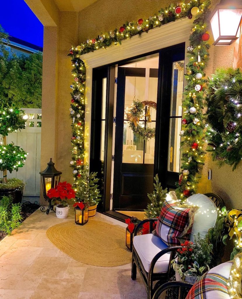 Cozy porch with plaid pillows and warm lighting