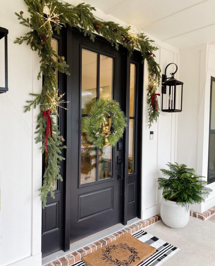 Minimalist black door with starry garlands