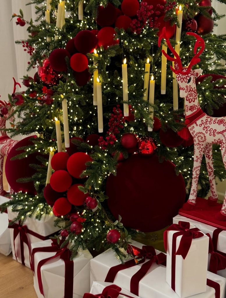 Red Christmas tree with candles