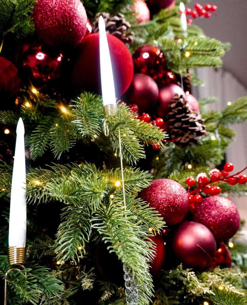 Traditional red Christmas tree with pinecones