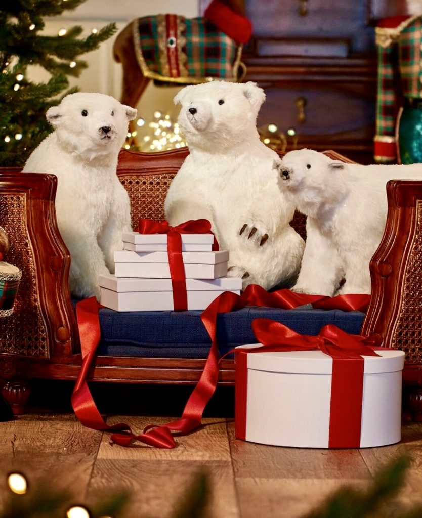 Polar bears and red ribbon fireplace decoration
