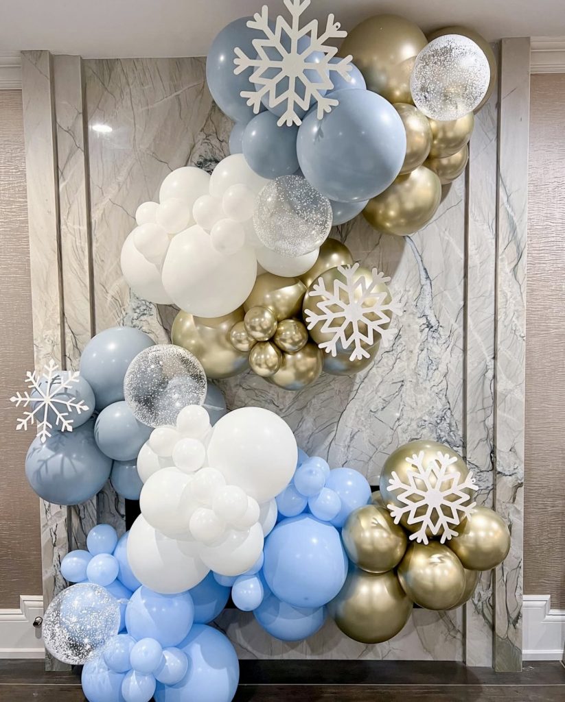 Blue and gold balloon garland with snowflakes