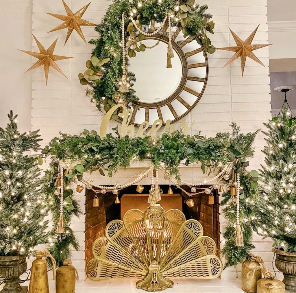 Golden mantel with greenery