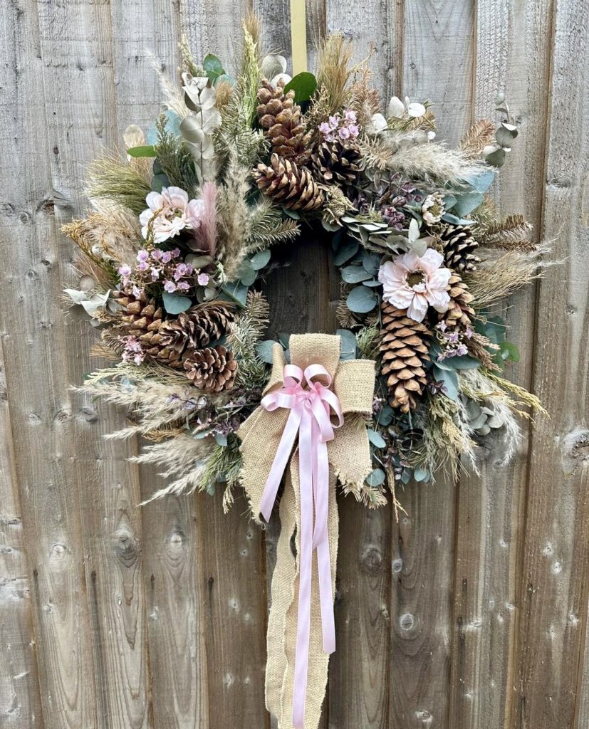 Rustic wreath with pinecones and burlap