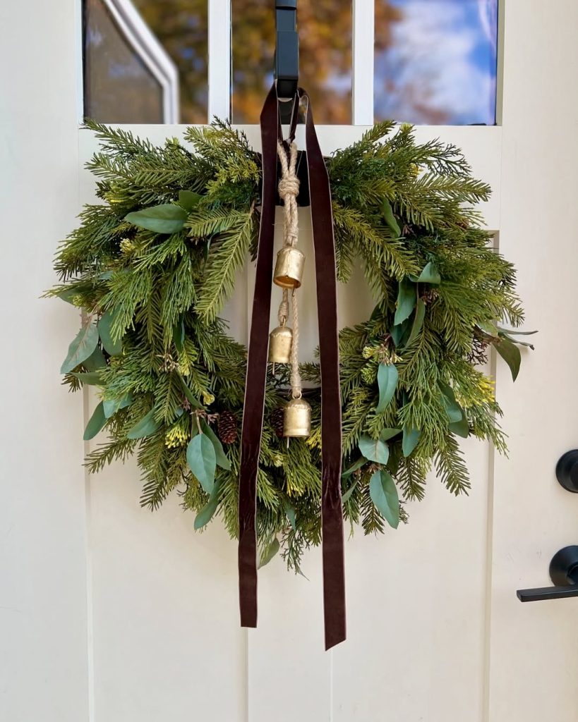 Evergreen wreath with bronze bells