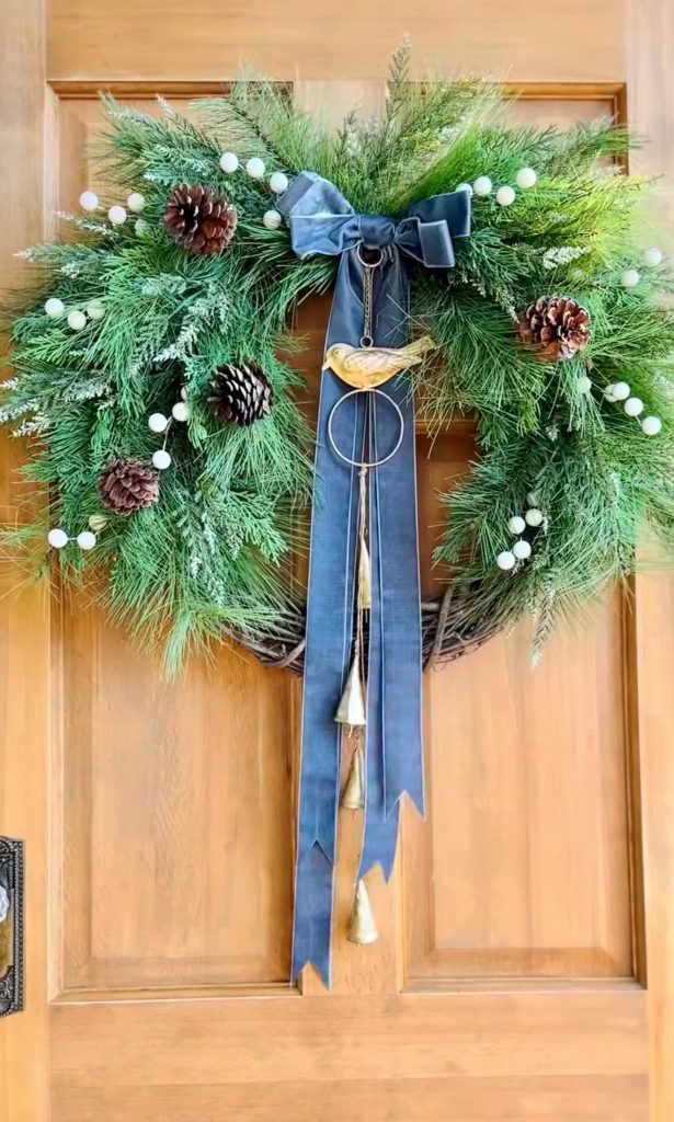 Evergreen wreath with bird accent