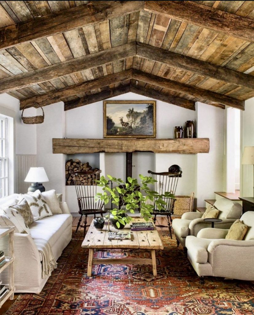 Moody rustic farmhouse living room with exposed beams