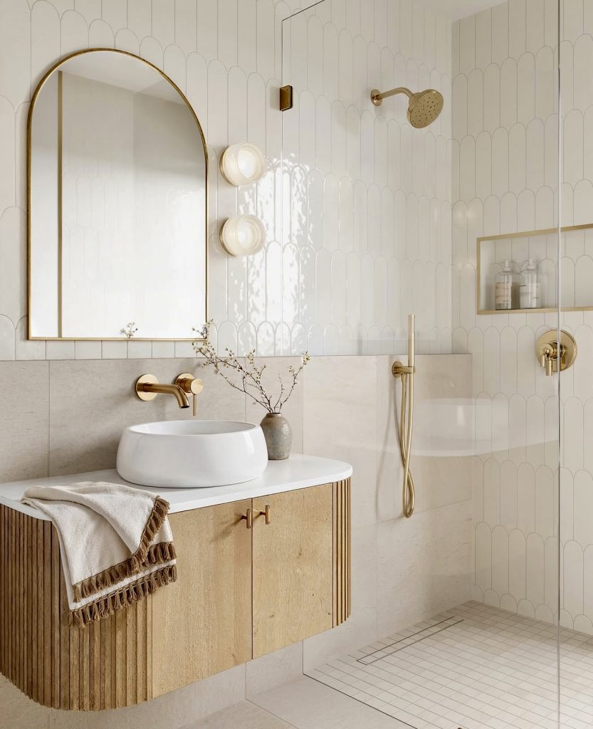 Spa-inspired bathroom with white and gold features