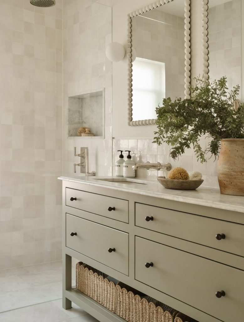 Bathroom with pale green vanity and white tiles