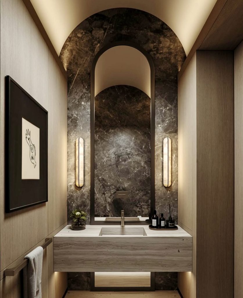 Bathroom with dramatic arched vanity and dark marble