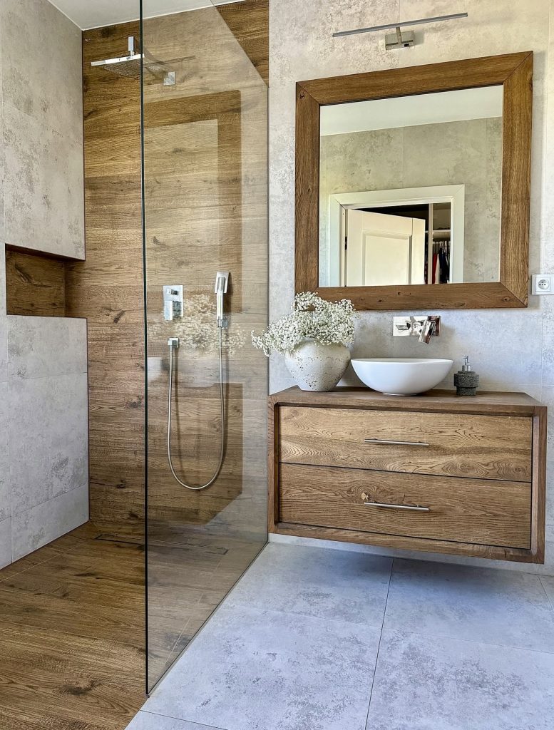 Bathroom with wood walls and floating vanity