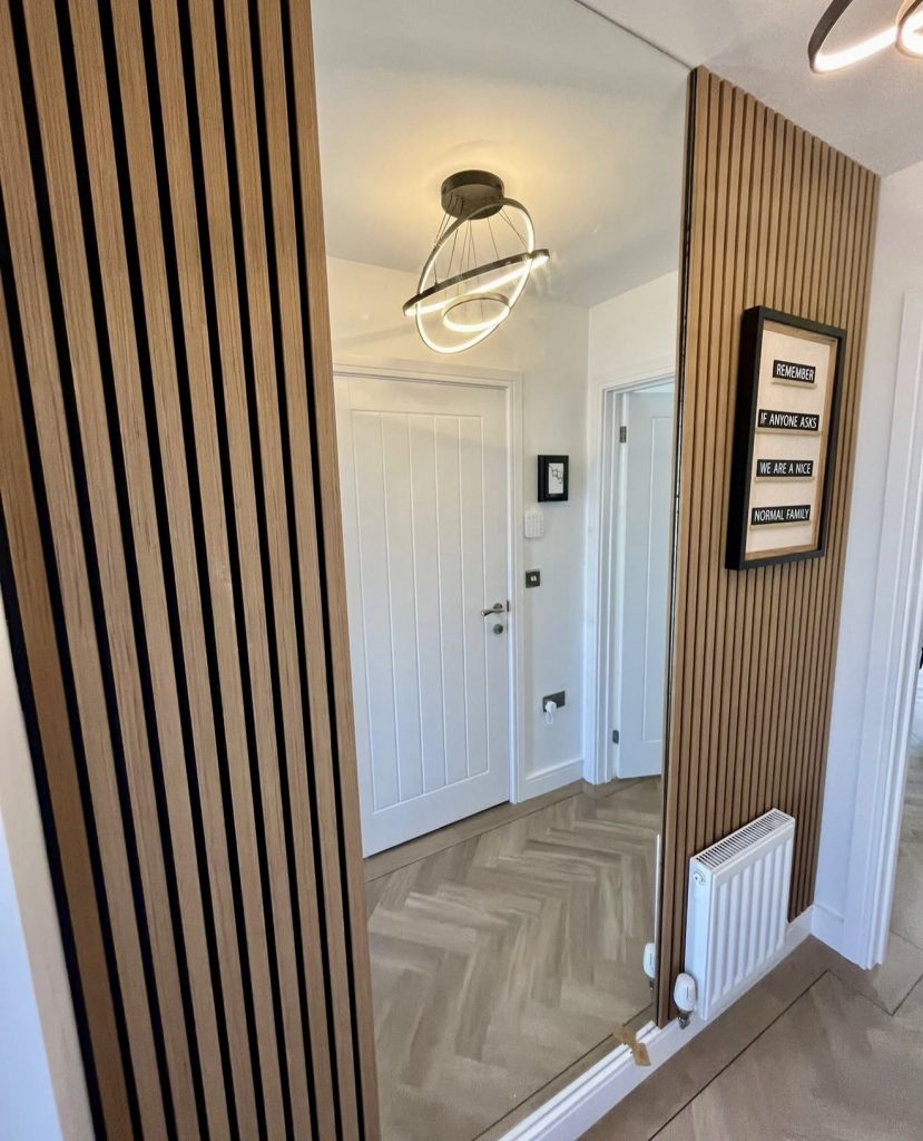 Entrance Mirror With Vertical Wood Panel Accent
