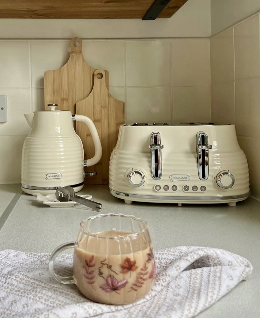 Minimal cozy kitchen corner with cream appliances