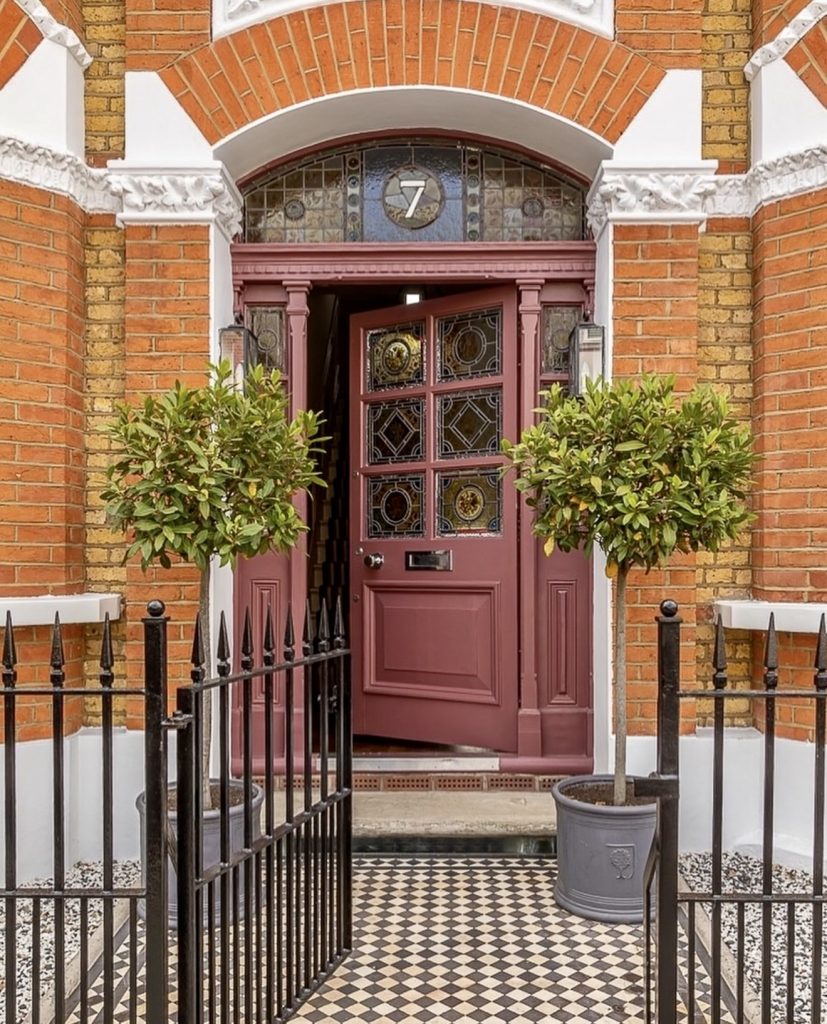 Dusty Purple Door on Red Brick House