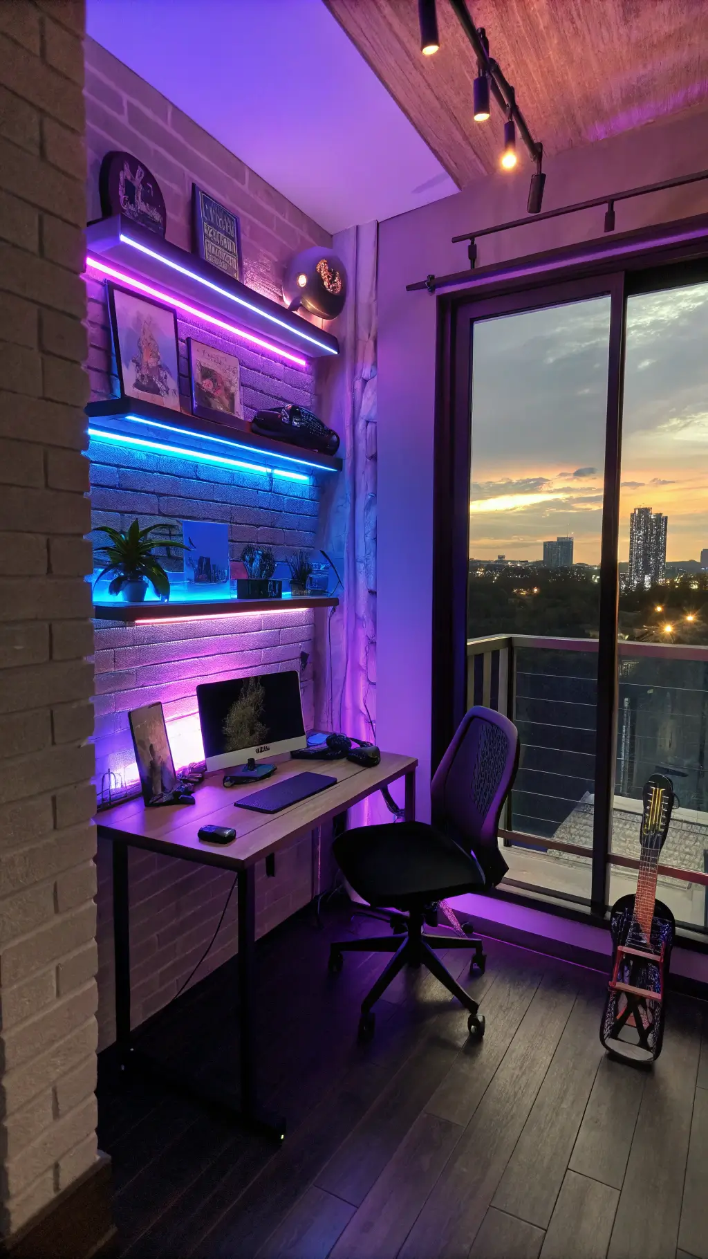 Contemporary home office featuring exposed brick, purple and blue LED lights, vintage metal desk, ergonomic black chair, steel shelves with skateboard art, and city skyline through industrial windows at dusk.