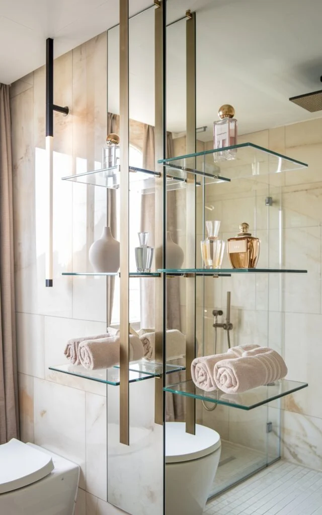 Bathroom with gold-accented shelves