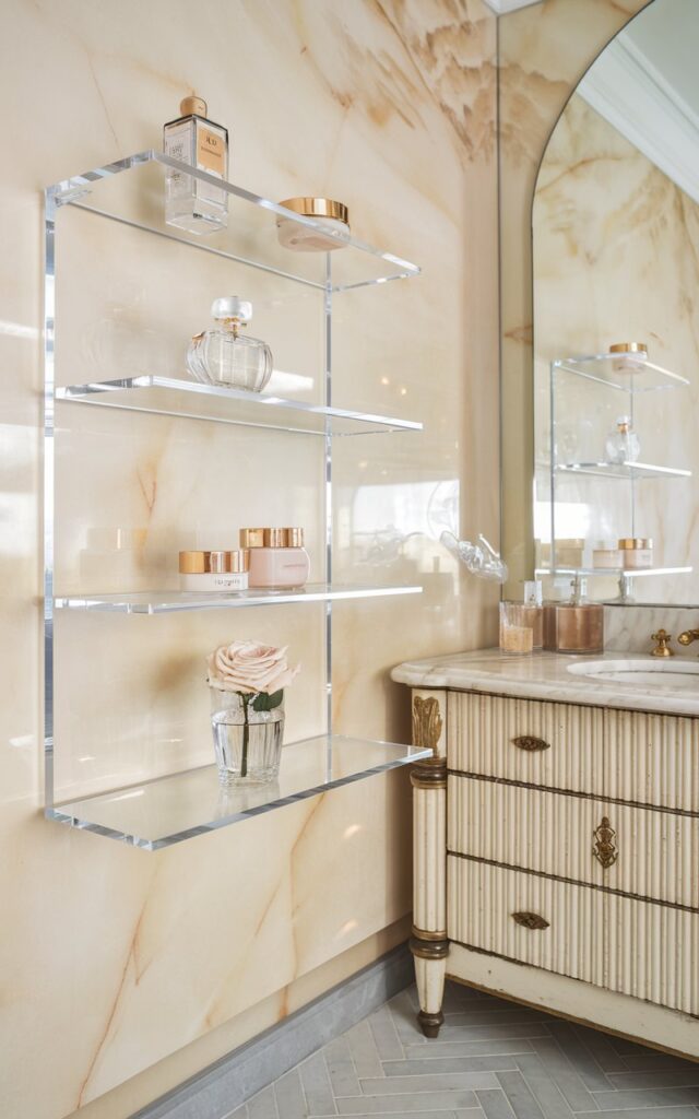 European glam bathroom with clear Lucite shelves
