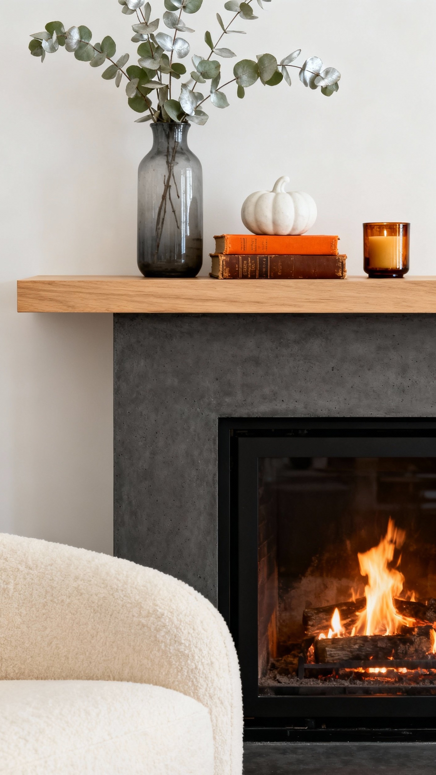 living room modern fall decor ideas - Warmth and Elegance in a Modern Living Room - Concrete fireplace and autumn decor
