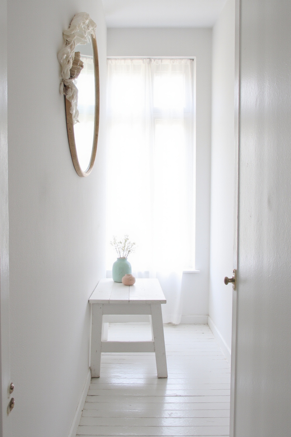 end of hallway decor - Bright and Airy Scandinavian Hallway End - White walls and natural wood mirror...