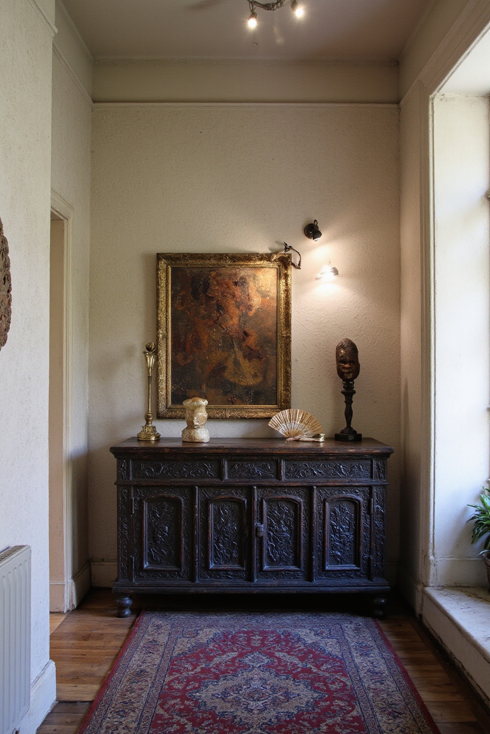 end of hallway decor - Global Gallery - Ebony credenza with international artifacts and warm lighting...