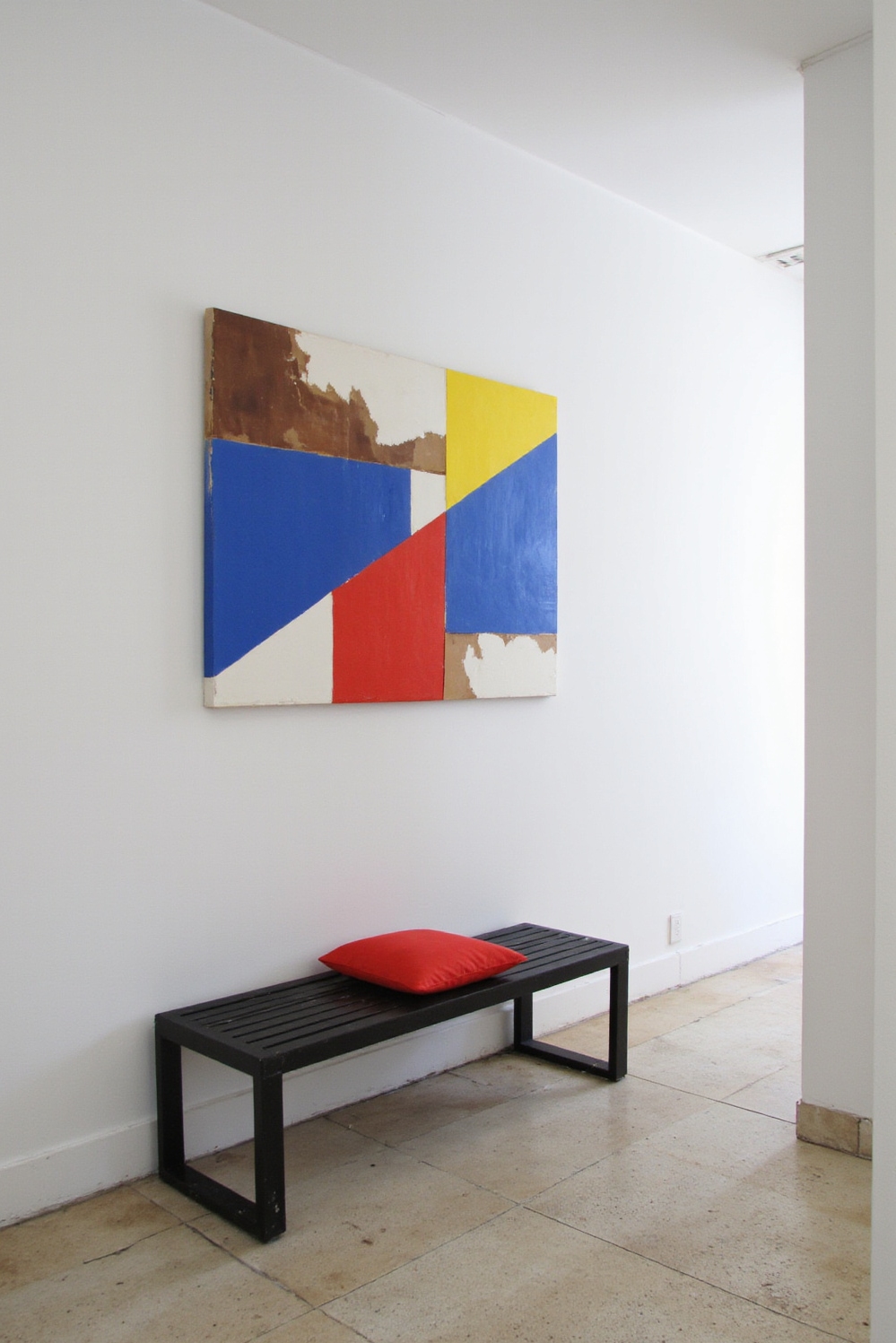 end of hallway decor - Geometric Art - Bright primary colors and black bench with red cushion...