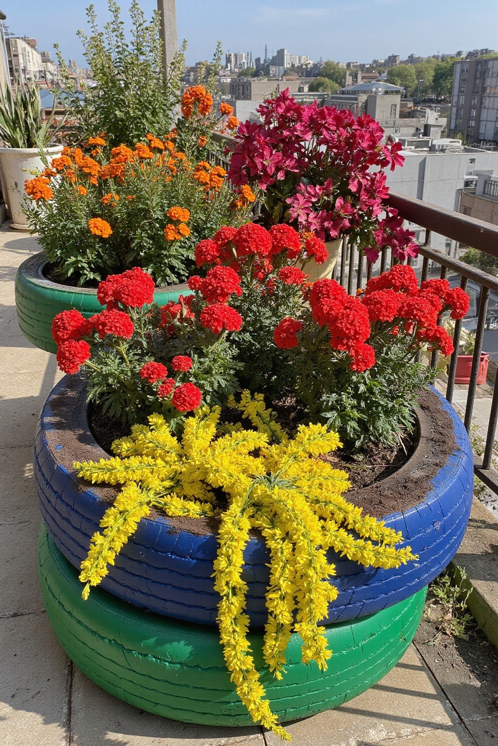 urban garden ideas - Bold Blooms From Recycled Tires - Vibrant colors explode from upcycled tires in this...