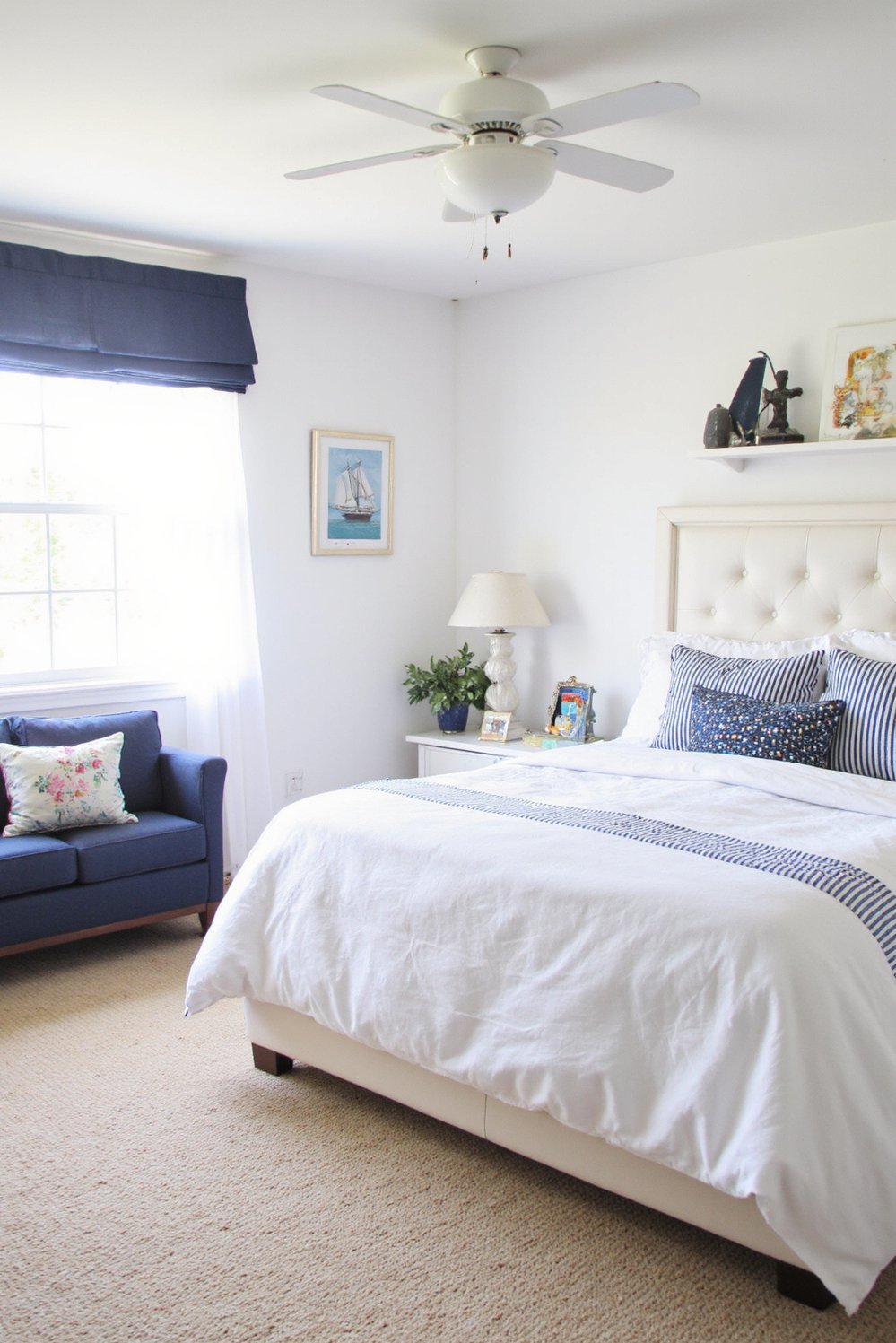 White bedroom decor ideas - Coastal White Bedroom: Navy Accents and Nautical Flair - Nautical themed white bedroom with navy stripes