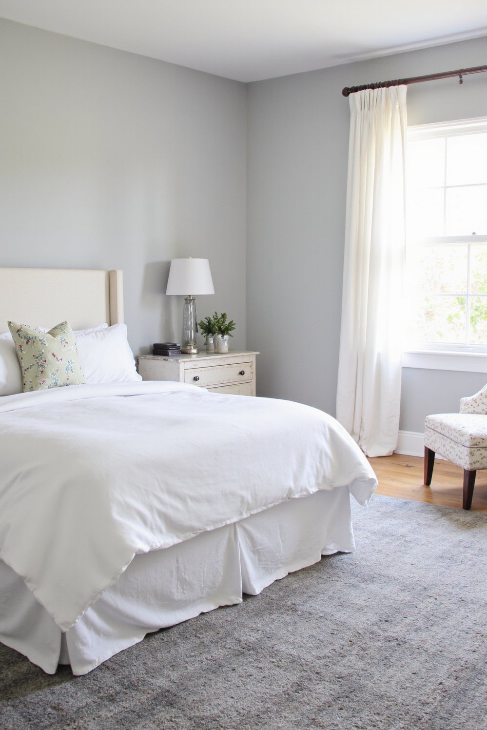 White bedroom decor ideas - Elegant Grey and White Bedroom: Subtle Contrast and Warmth - Sophisticated white bedroom with grey accents