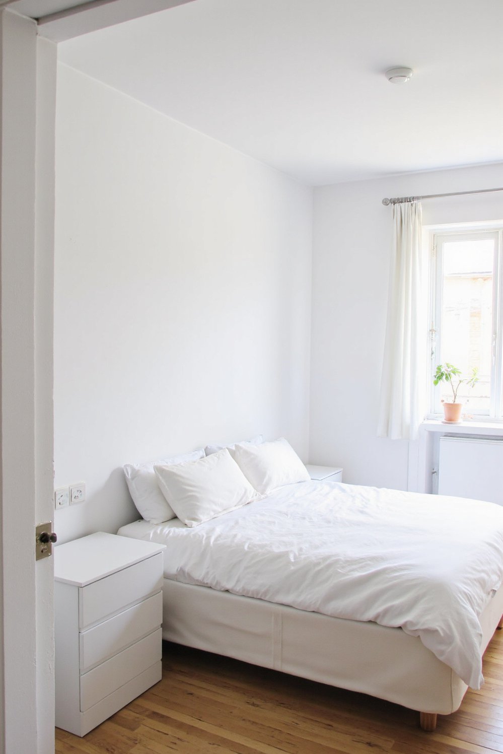 White bedroom decor ideas - Compact Studio White Bedroom: Multifunctional and Stylish - Small white bedroom with sofa bed