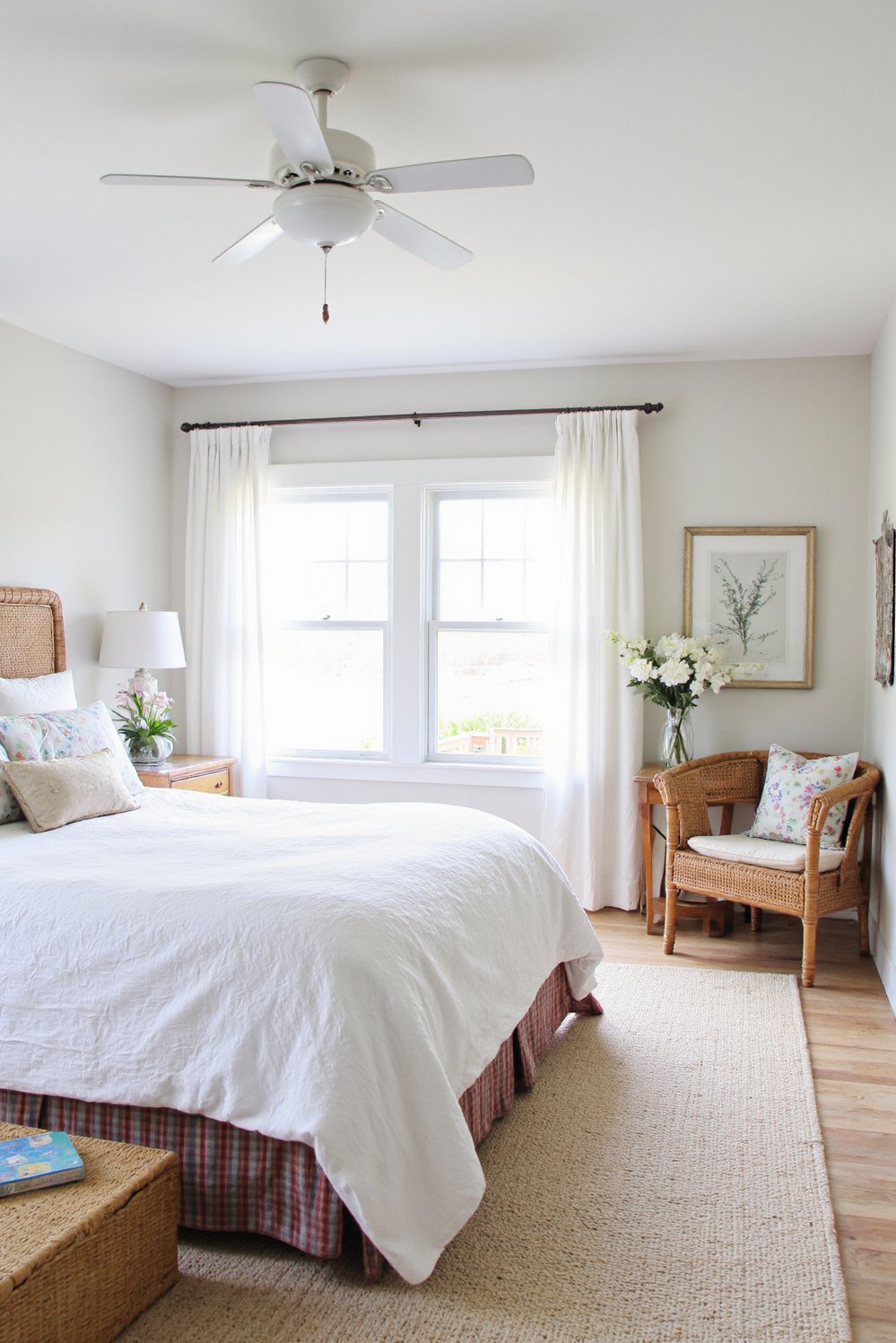 White bedroom decor ideas - Coastal Retreat: Airy White Bedroom with Natural Elements - Beach style white bedroom with wicker furniture