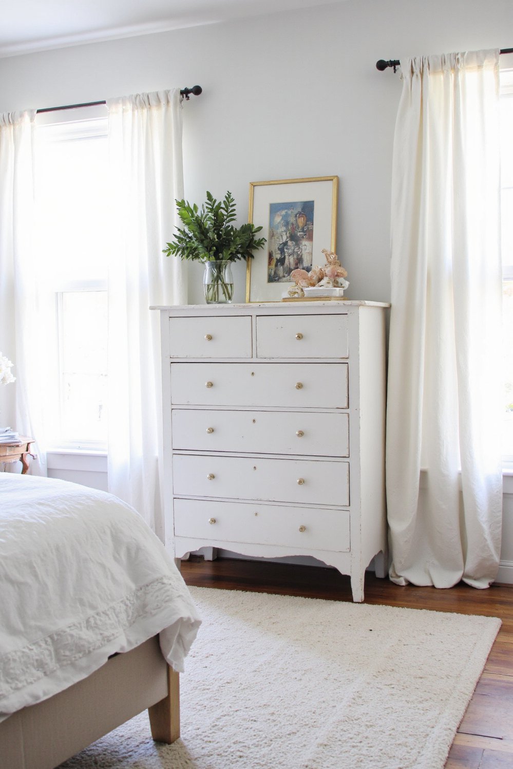 White bedroom decor ideas - Antique Meets Modern: White Bedroom with Statement Dresser - White bedroom with antique dresser and modern furniture