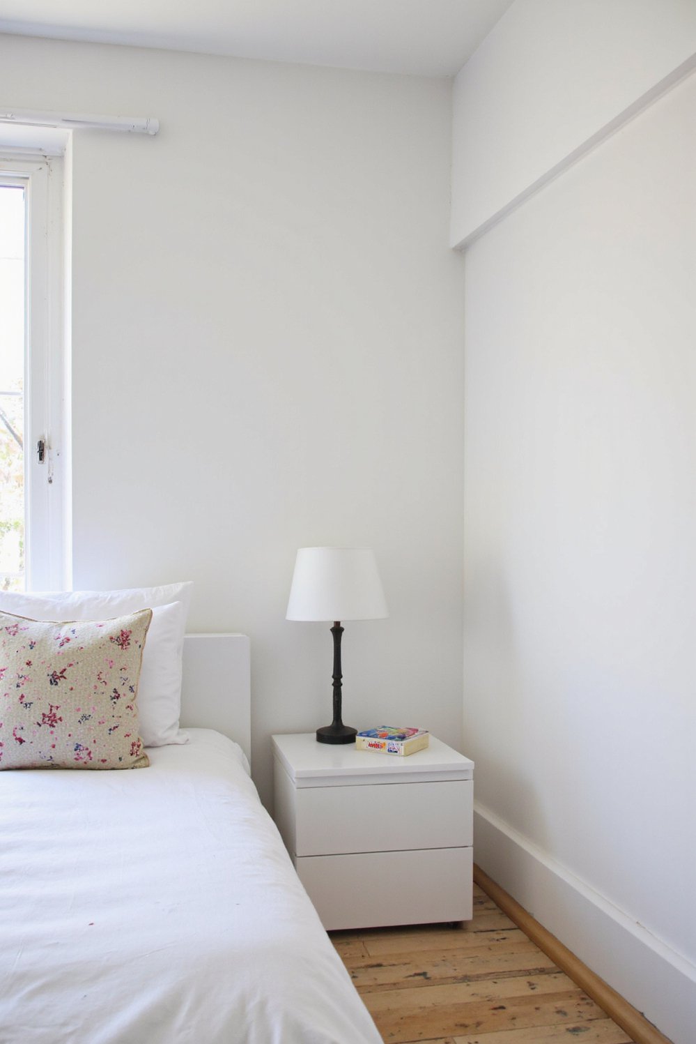 White bedroom decor ideas - Streamlined Simplicity: Minimalist White Bedroom Essentials - Minimalist white bedroom with clean furniture