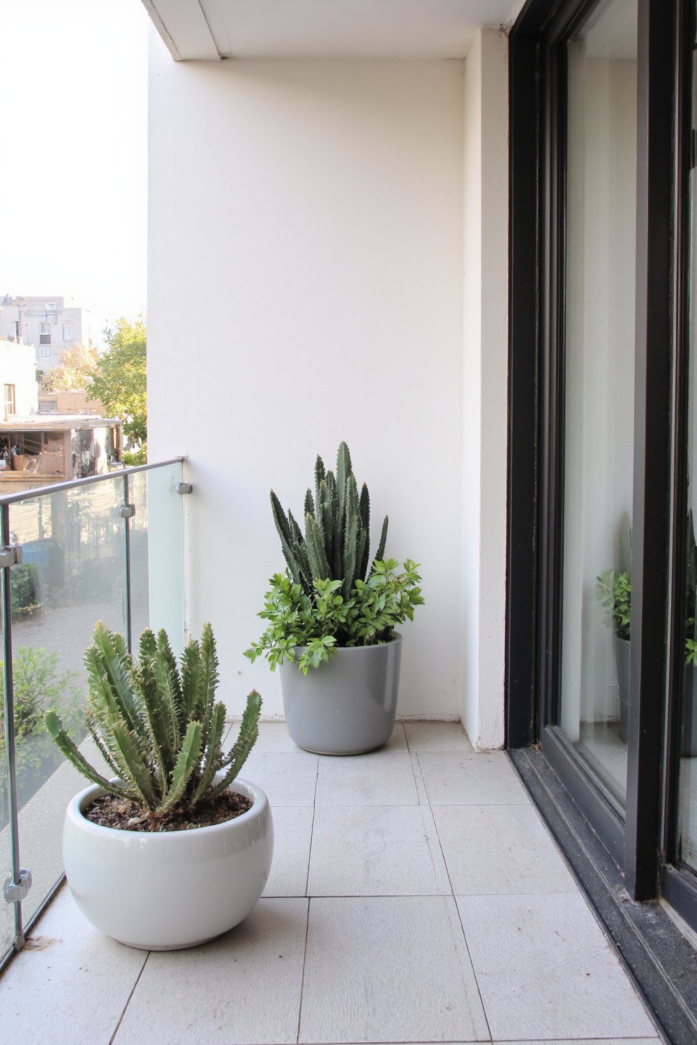 Balcony flooring ideas - Elegant and Practical: Wood-Effect Porcelain Tiles for Modern Balconies - Refresh your balcony with light grey porcelain tiles...
