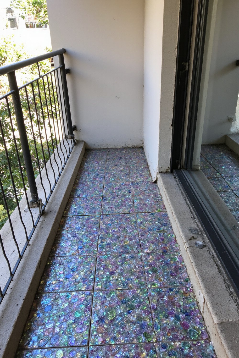 Balcony flooring ideas - Eco-Friendly Sparkle: Recycled Glass Tiles for Small Balconies - Brighten your balcony with shimmering recycled glass tiles...