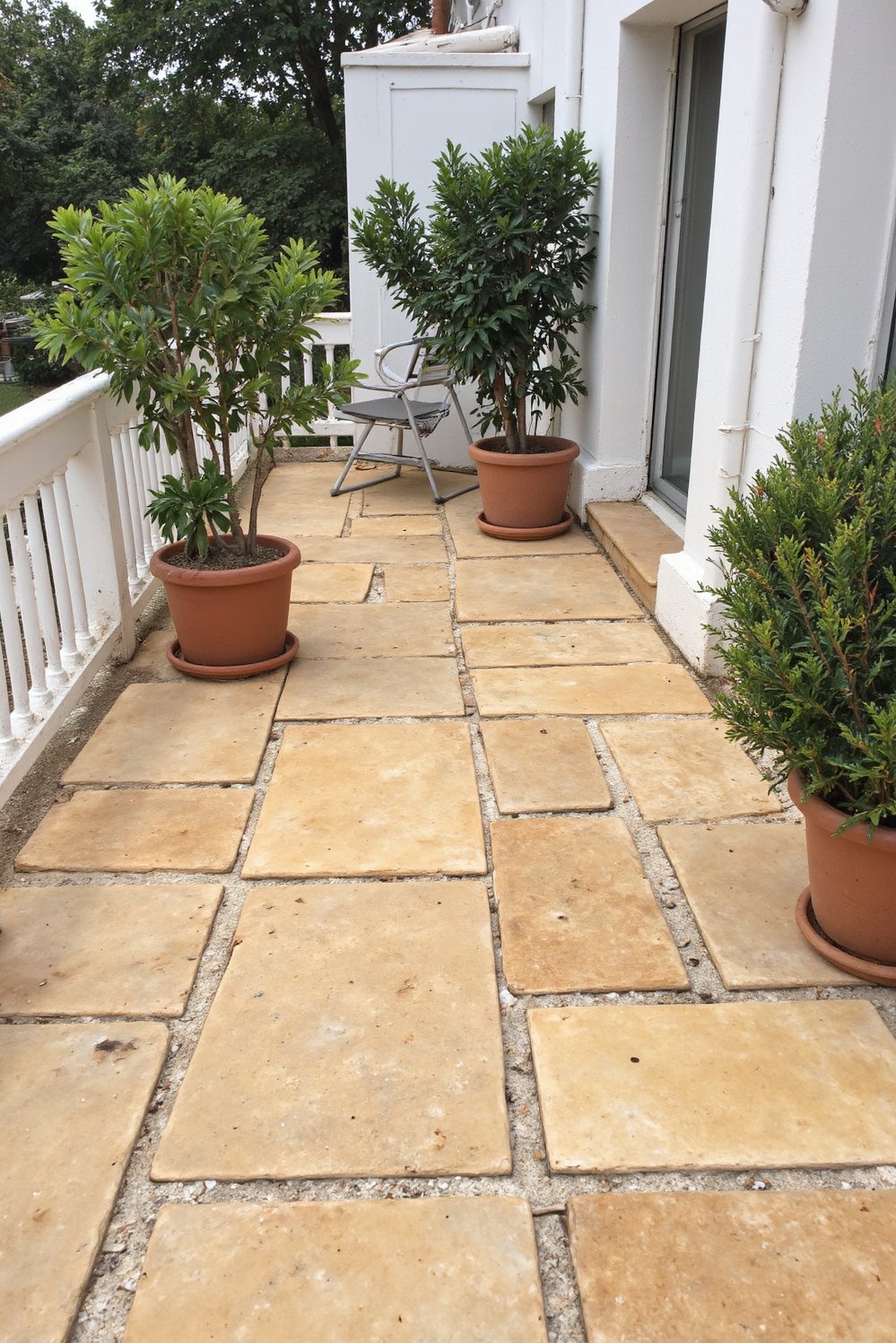 Balcony flooring ideas - Natural Stone Serenity: Beige Paving for Relaxed Outdoor Spaces - Use large beige paving stones for a calm balcony floor...