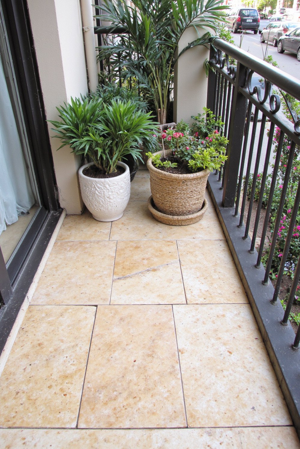 Balcony flooring ideas - Timeless Elegance: Travertine Flooring for Sophisticated Balconies - Enhance your balcony with elegant travertine tiles...