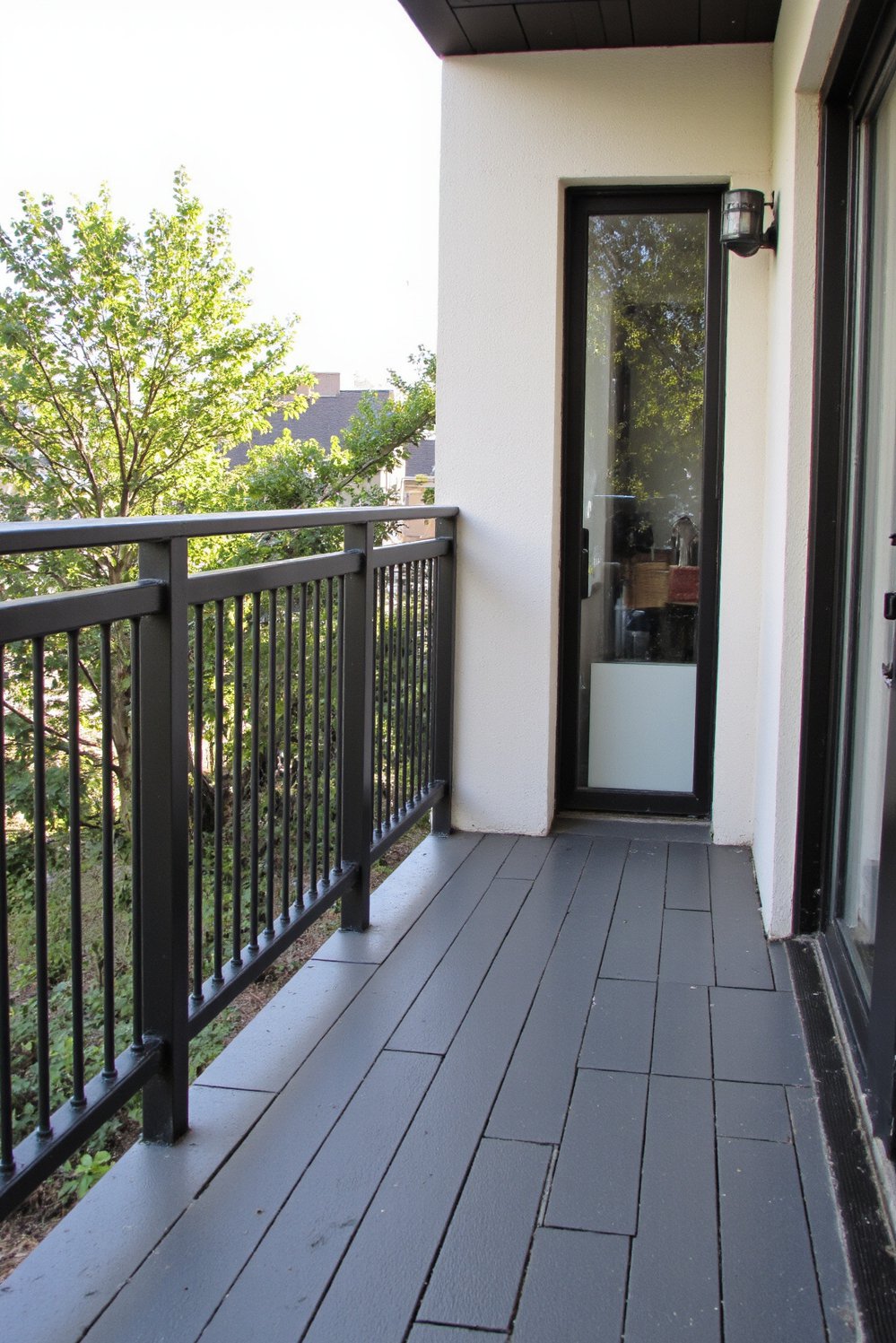 Balcony flooring ideas - Durable and Stylish: Dark Grey Composite Decking for Modern Balconies - Use composite decking for a sleek, low-maintenance balcony...