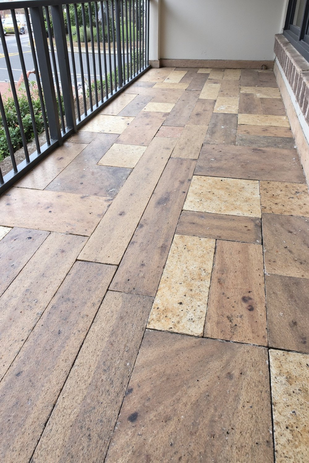 Balcony flooring ideas - Natural Harmony: Wood and Stone Combination for Balcony Floors - Blend wood and stone for a textured balcony floor...