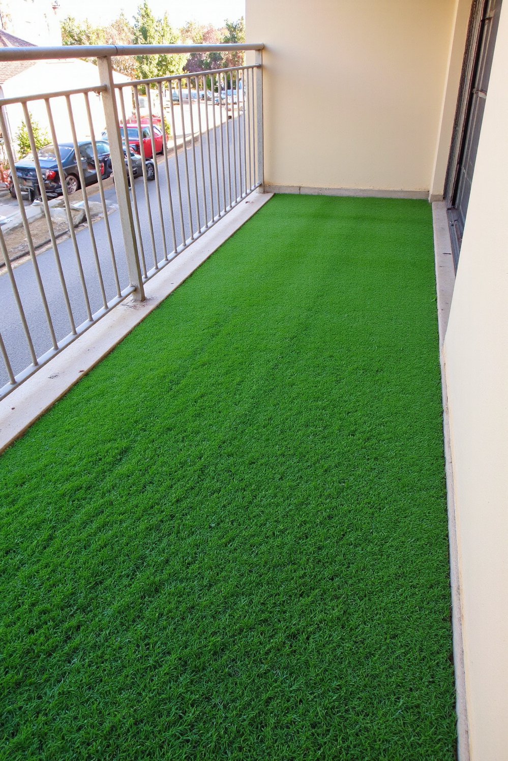 Balcony flooring ideas - Vibrant Greenery: Artificial Turf for Lush Balcony Gardens - Use artificial grass to create a green balcony space...