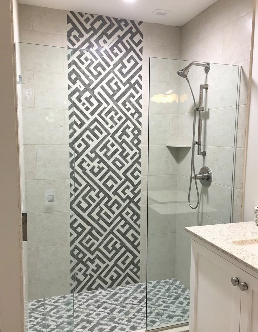 bathroom shower tile ideas - Eclectic Patterned Tiles: Stylish Bathroom Shower Remodel - This eclectic shower design mixes patterned tiles in...