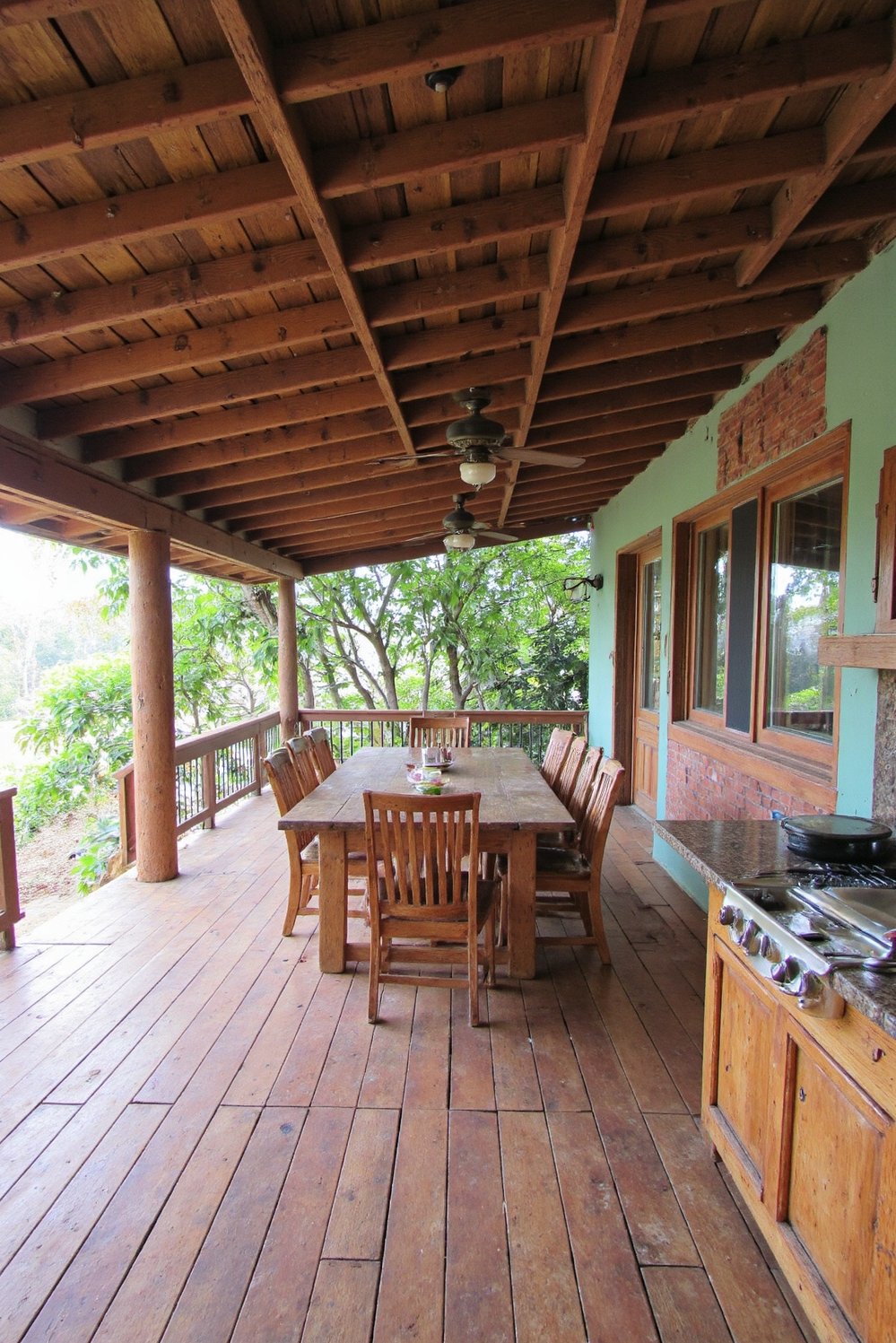 tropical house design ideas - Rustic Elegance: Tropical Vacation Home with Expansive Deck