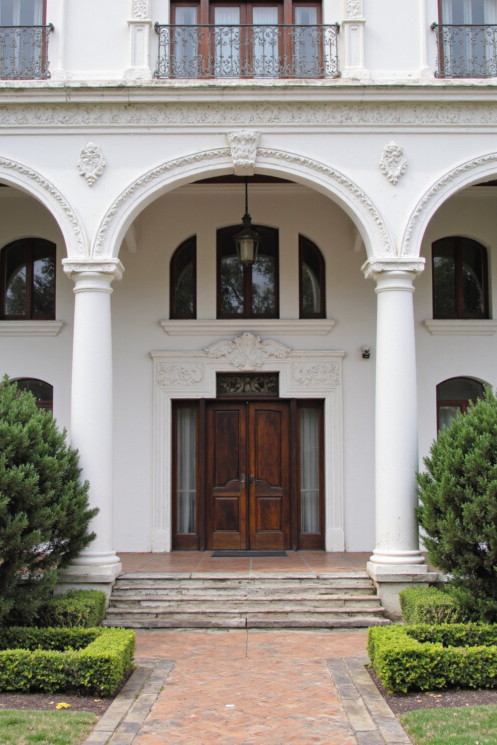 Italian villas exteriors - Spanish Villa: Grand Columns and Lush Gardens - Elegant Spanish style home with ornate details…