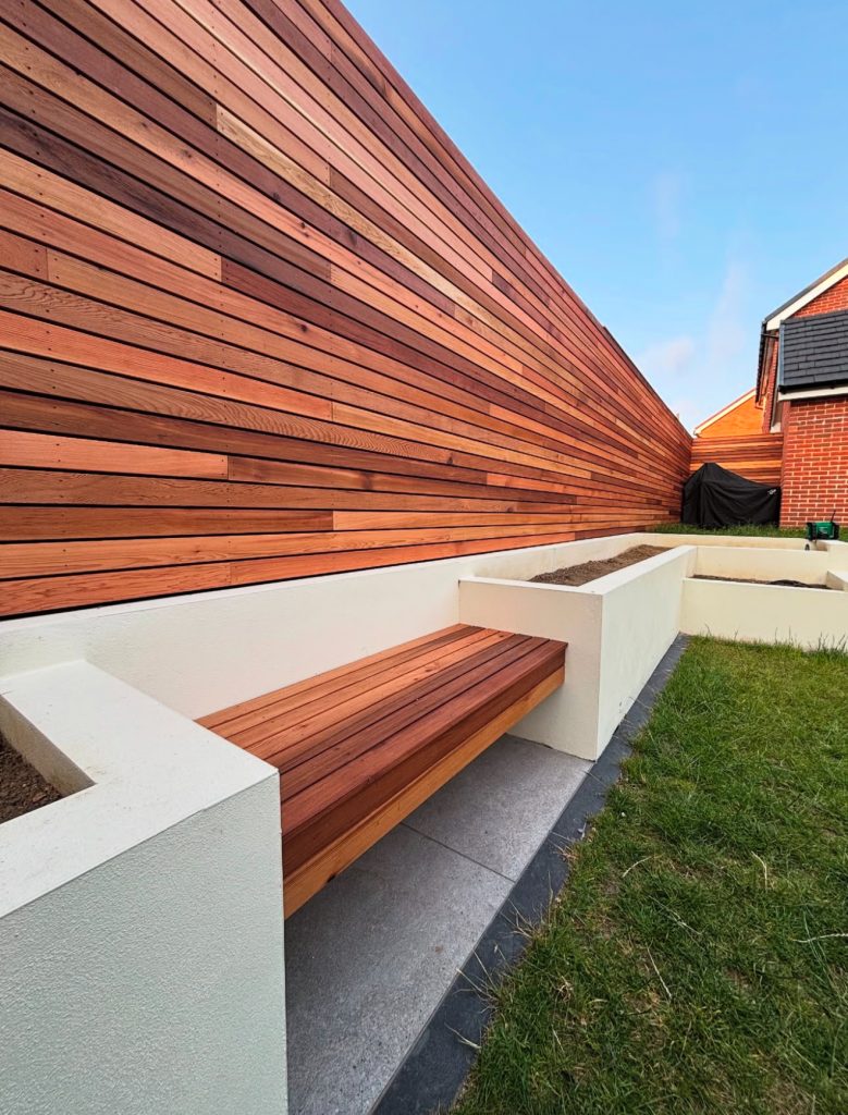 Horizontal slatted fence with built-in benches