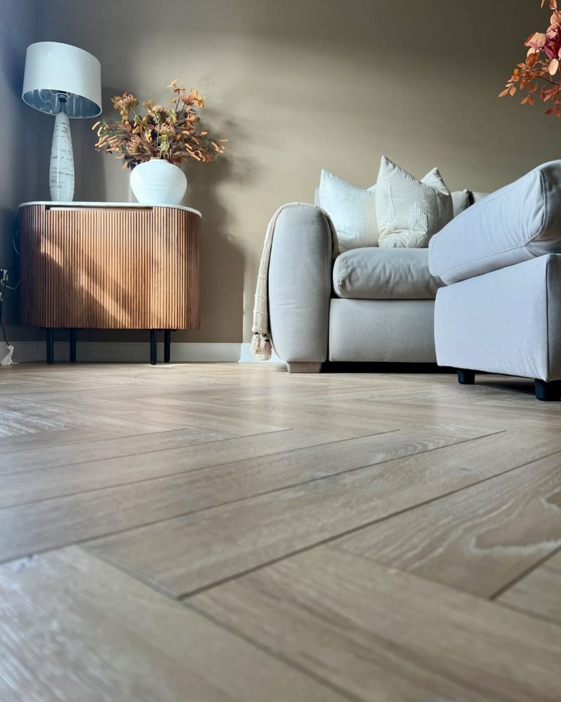 Herringbone wood flooring in living room