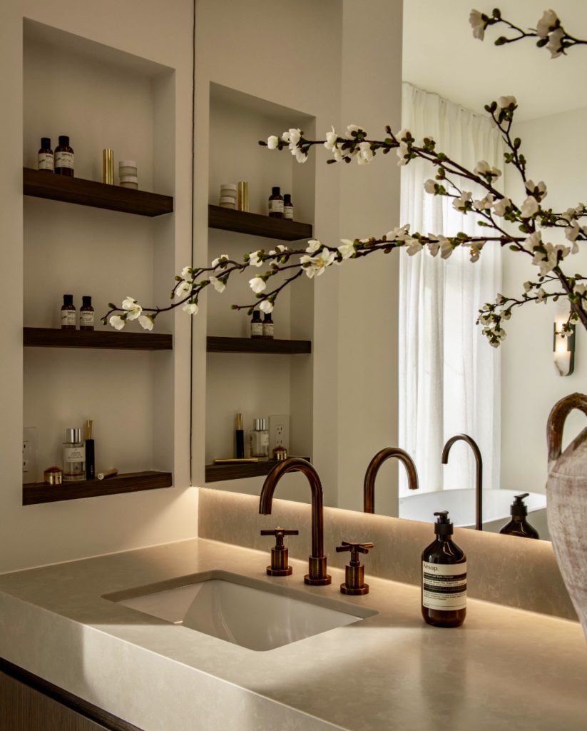 Modern bathroom with warm bronze fixtures